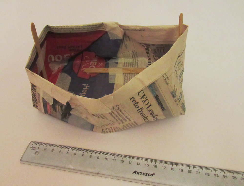 High-walled, Boat-like Newspaper Water Tank