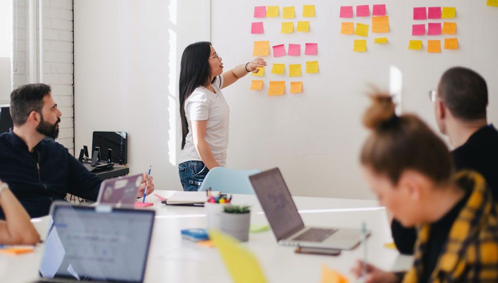 MYP Design Criterion B brainstorming session using sticky notes in a classroom. Photo by You X Ventures